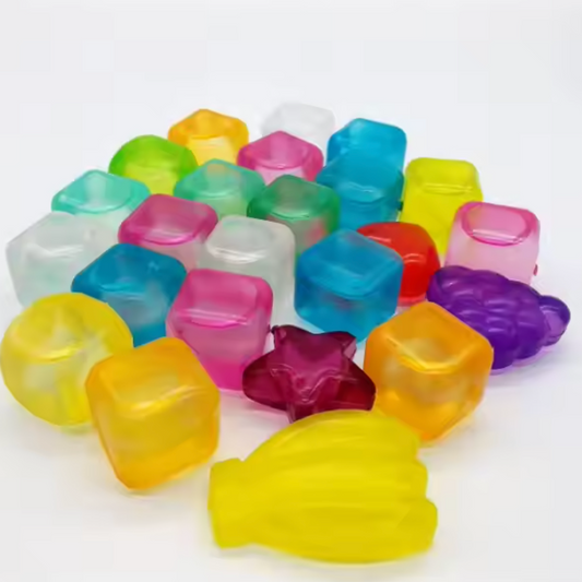 "Peças coloridas translúcidas para mesa de luz, ideais para atividades sensoriais e educativas."