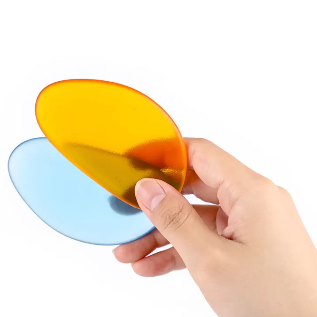 "Kit de Pedras Coloridas translúcidas para mesa de luz, ideal para atividades sensoriais e desenvolvimento cognitivo."