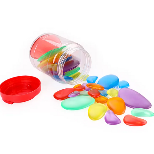 "Kit de Pedras Coloridas translúcidas para mesa de luz, ideal para atividades sensoriais e desenvolvimento cognitivo."